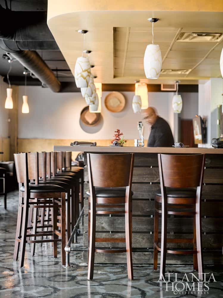 Interior bar with wooden chairs and warm lighting