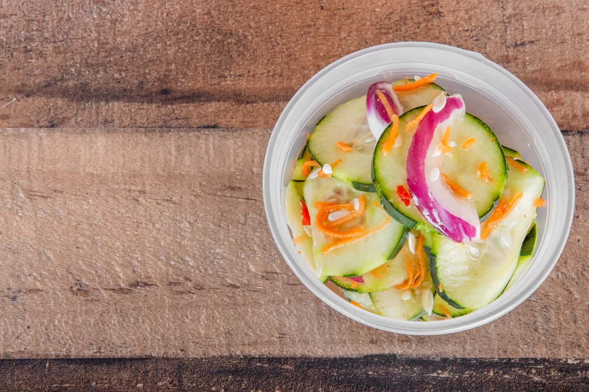 8 oz pickled cucumber salad at Kalei's Kitchenette, a refreshing Hawaiian side in San Diego