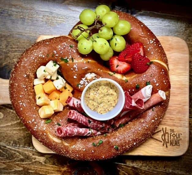 pretzel stuffed with meat, cheese, and fruit