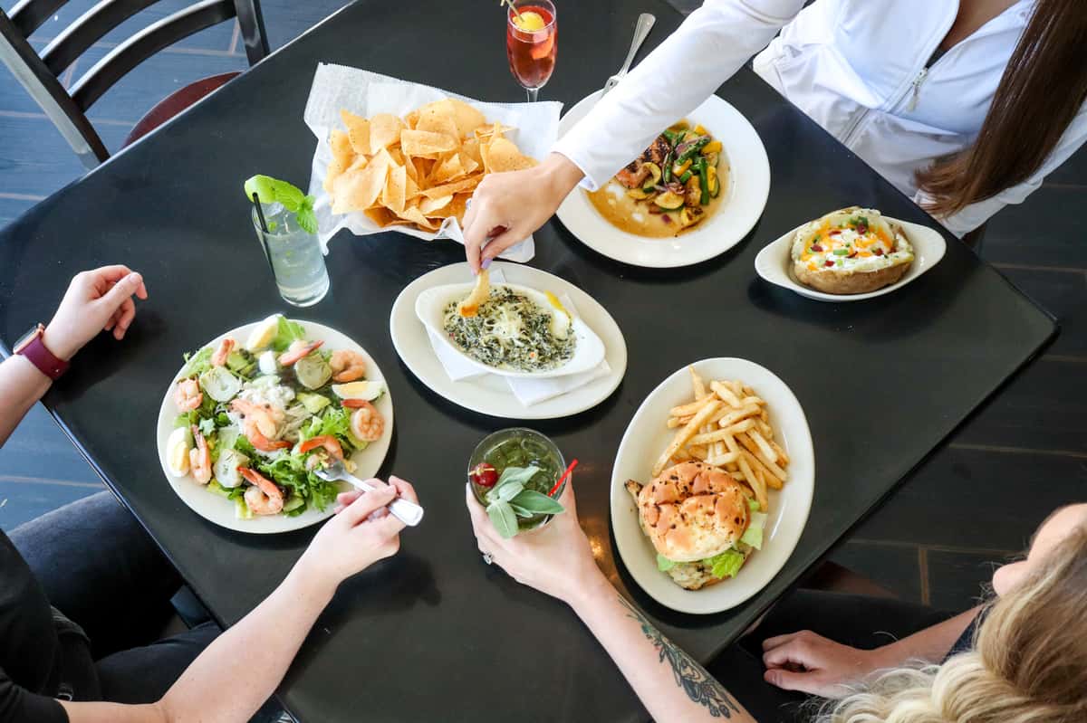 Various Appetizers with Burgers and Salads