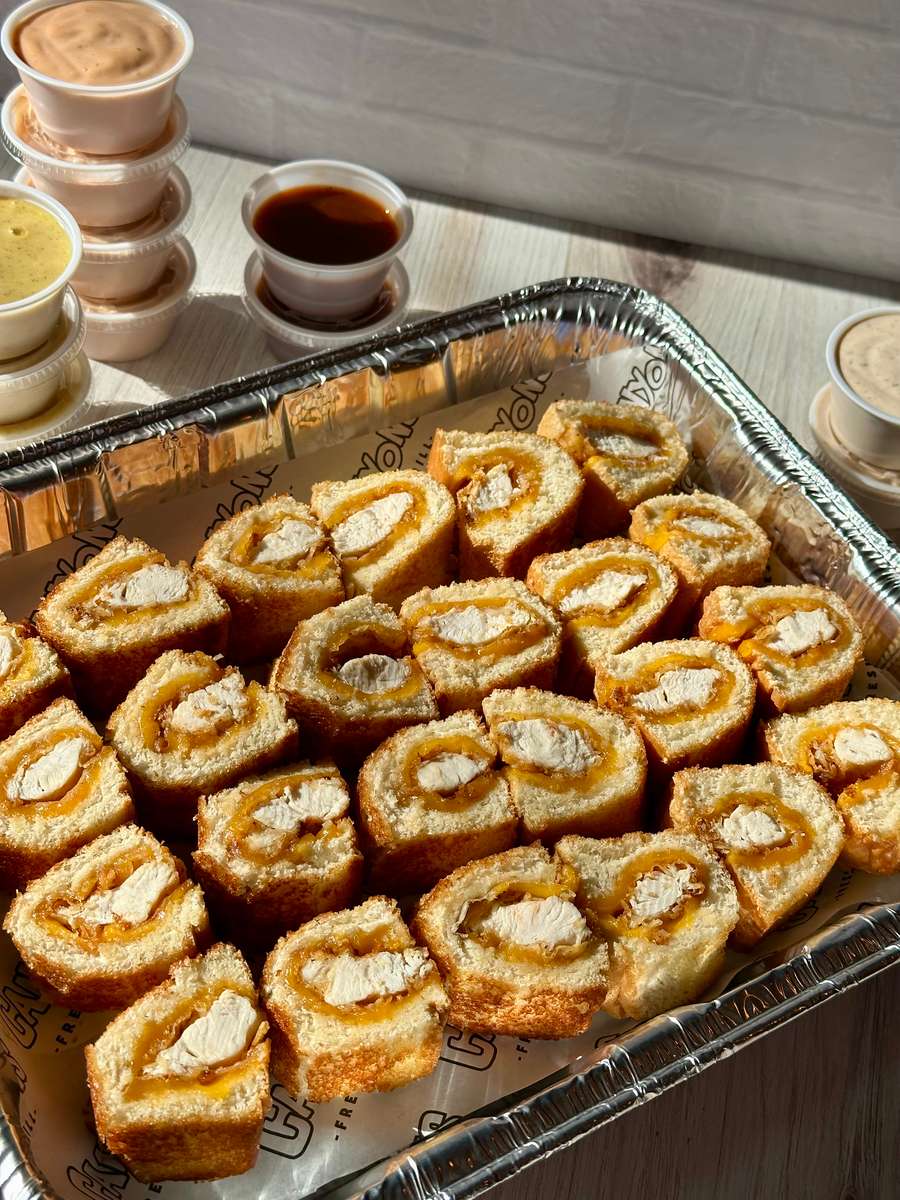 [Qty. 24] CRISPY CHICKEN TENDER & CHEDDAR CHEESE WRAPPED IN BUTTERY TEXAS TOAST. SERVED WITH SIGNATURE CANYONS SAUCE