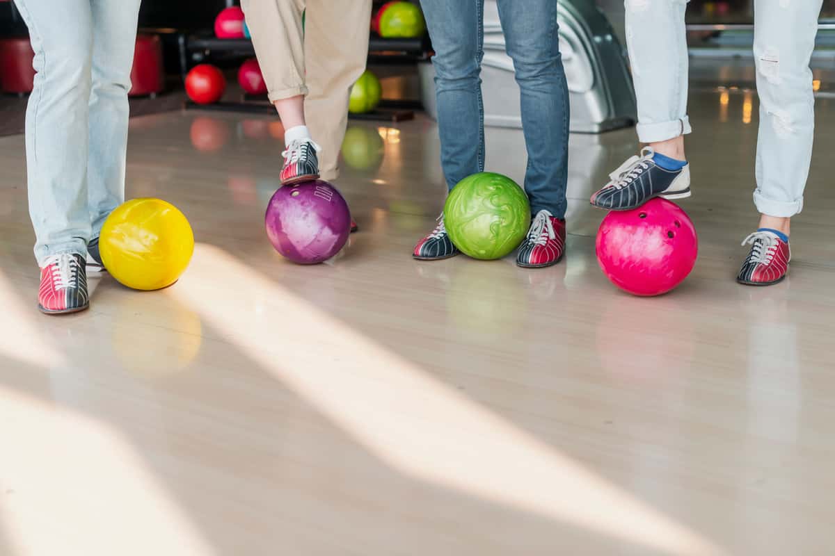 People with colorful bowling balls