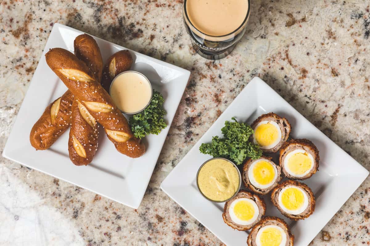 Appetizers - pretzels and scottish eggs with beer cheese