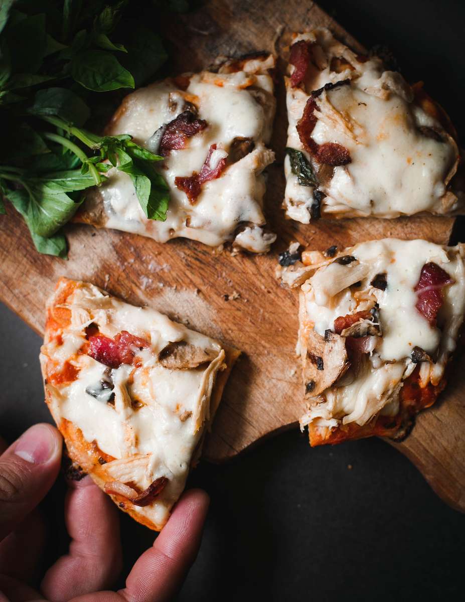 cheesy pizza with basil, mushroom and meat