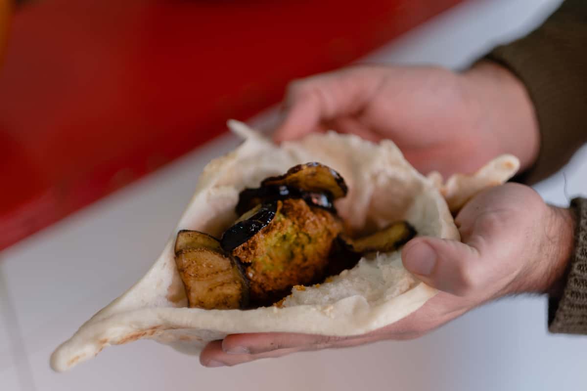 hands holding pita