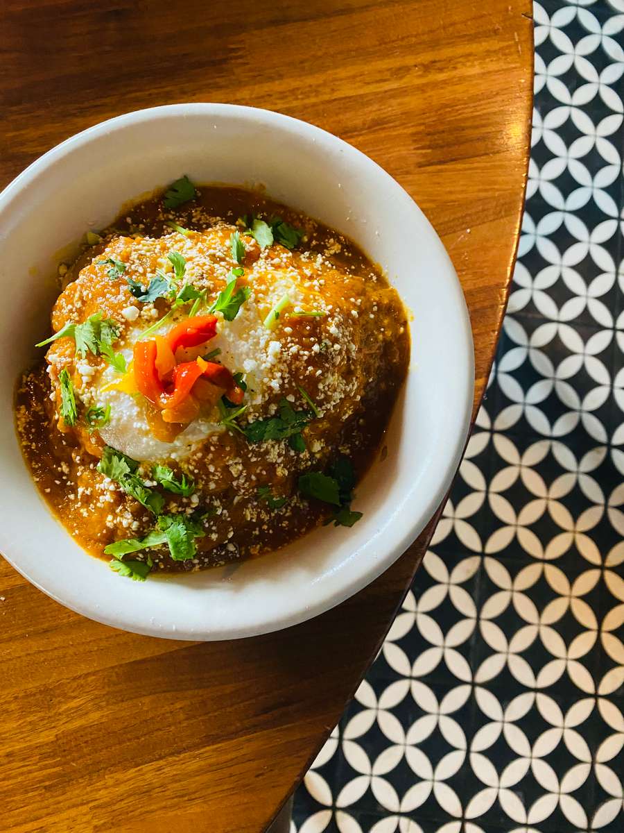 Fried eggs, manchego and jack cheese, ranchero salsa, onions, roasted red pepper, poblano, cabbage cilantro