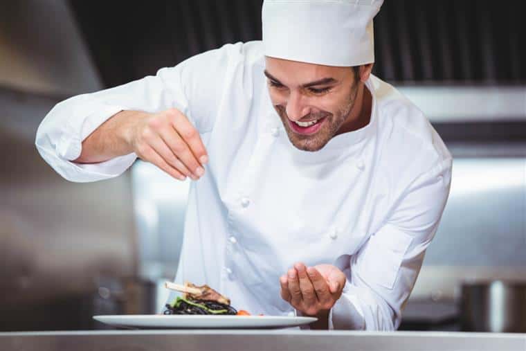 chef in the kitchen wearing a clean, fresh uniform