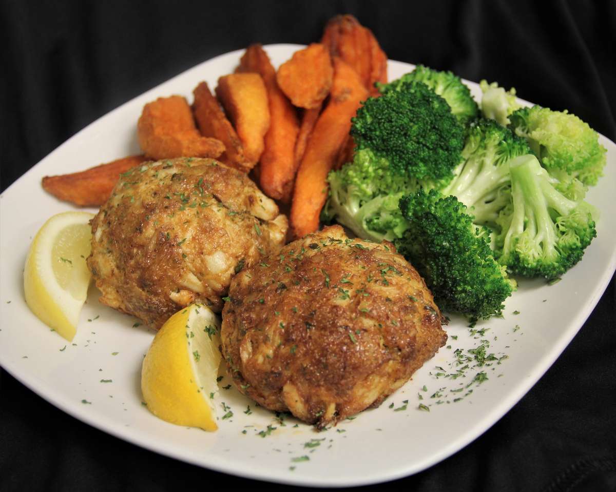 Baltimore Style Crab Cakes over wild rice and sautéed Brussels sprouts -  Picture of Starboard Raw, Dewey Beach - Tripadvisor