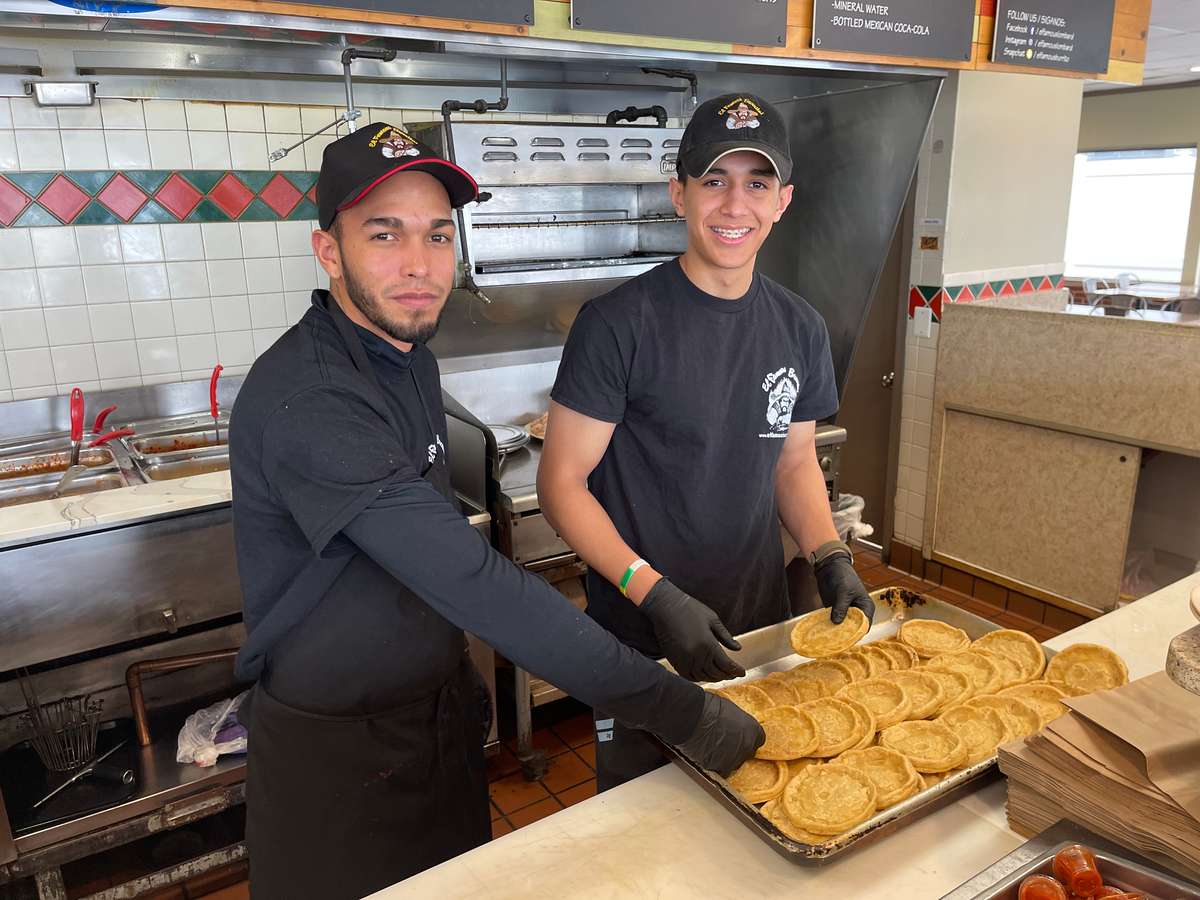 Employees making tacos