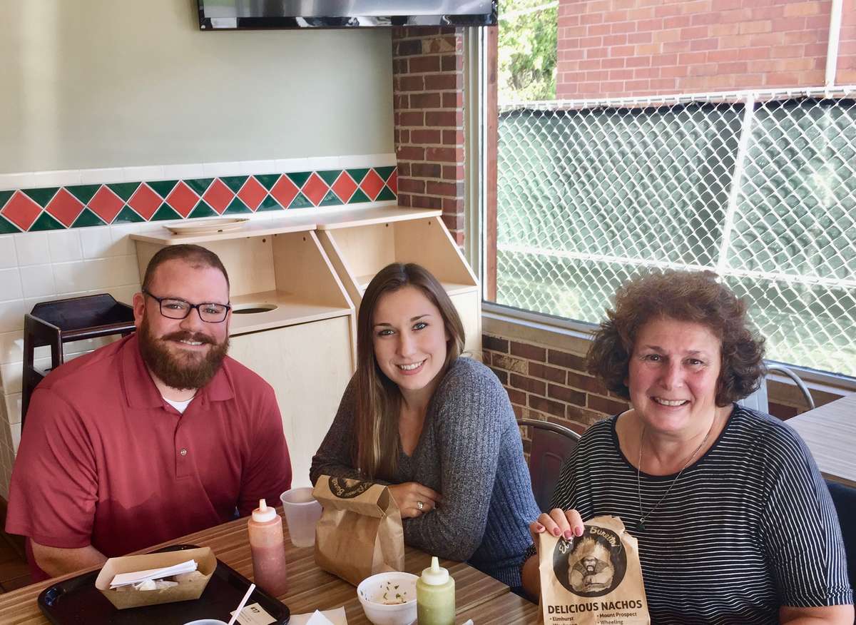 photo of the dining area with happy customers