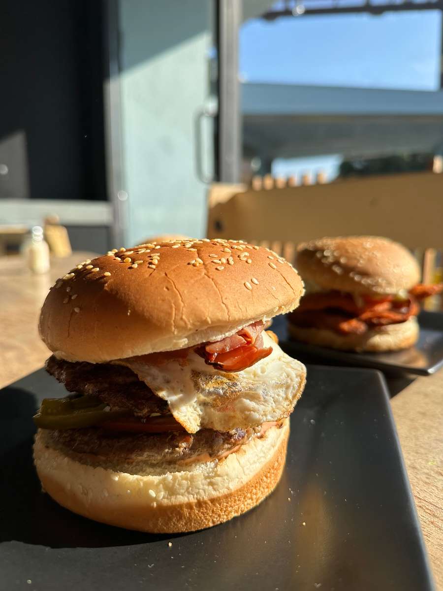 Burgers sitting on a table