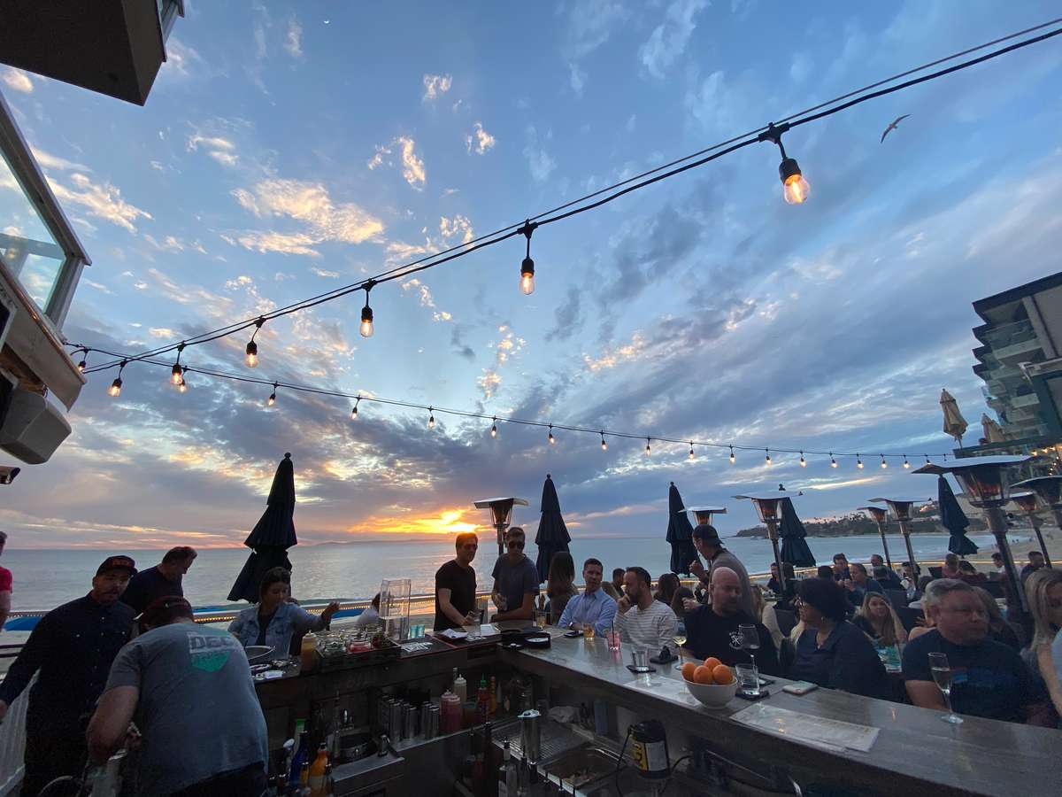 SUNSET PHOTO OF THE DECK RESTAURANT AND BEACH