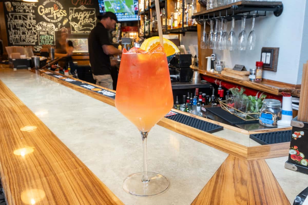Rum Punch cocktail sitting on the bar counter