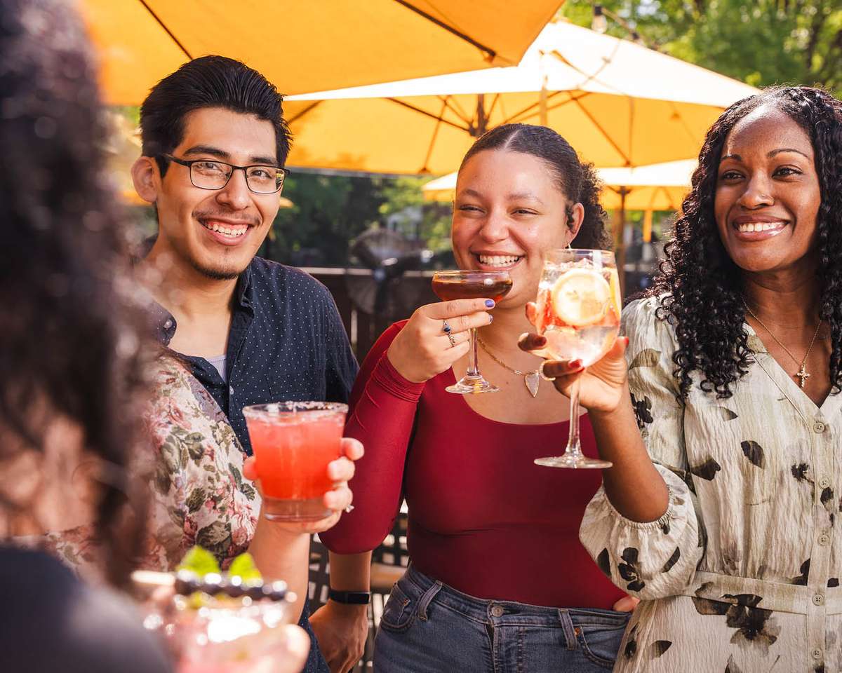 Friends enjoying drinks on patio
