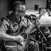 Jay Henry playing guitar