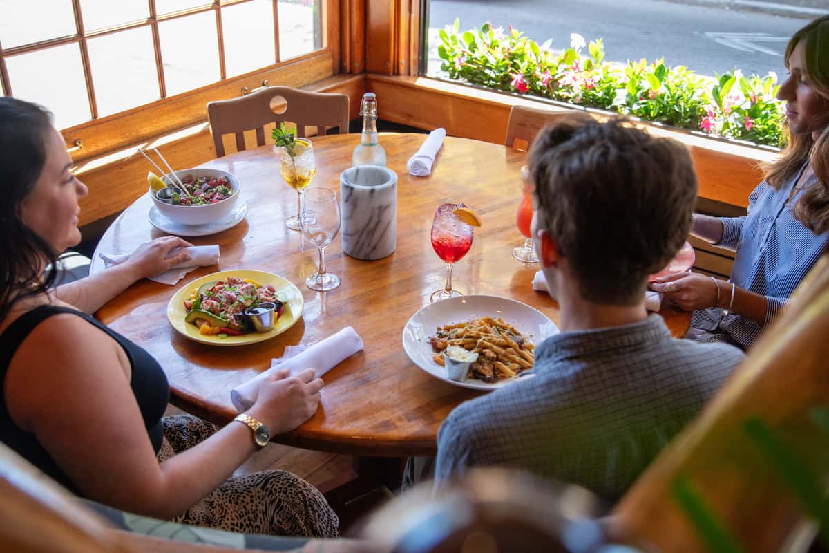 young group enjoying lunch in the summer