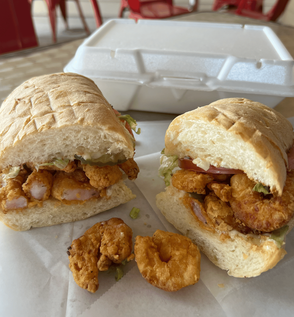 Fried shrimp poboy fully dressed with lettuce tomato and mayo