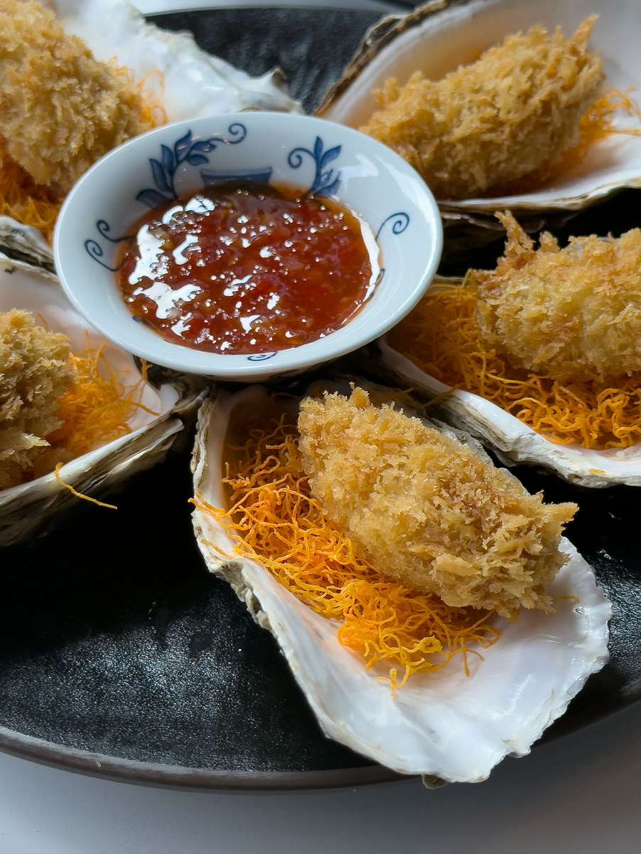 Crispy Japanese tempura served with a rich dipping sauce, available for online ordering and delivery from Sumiya