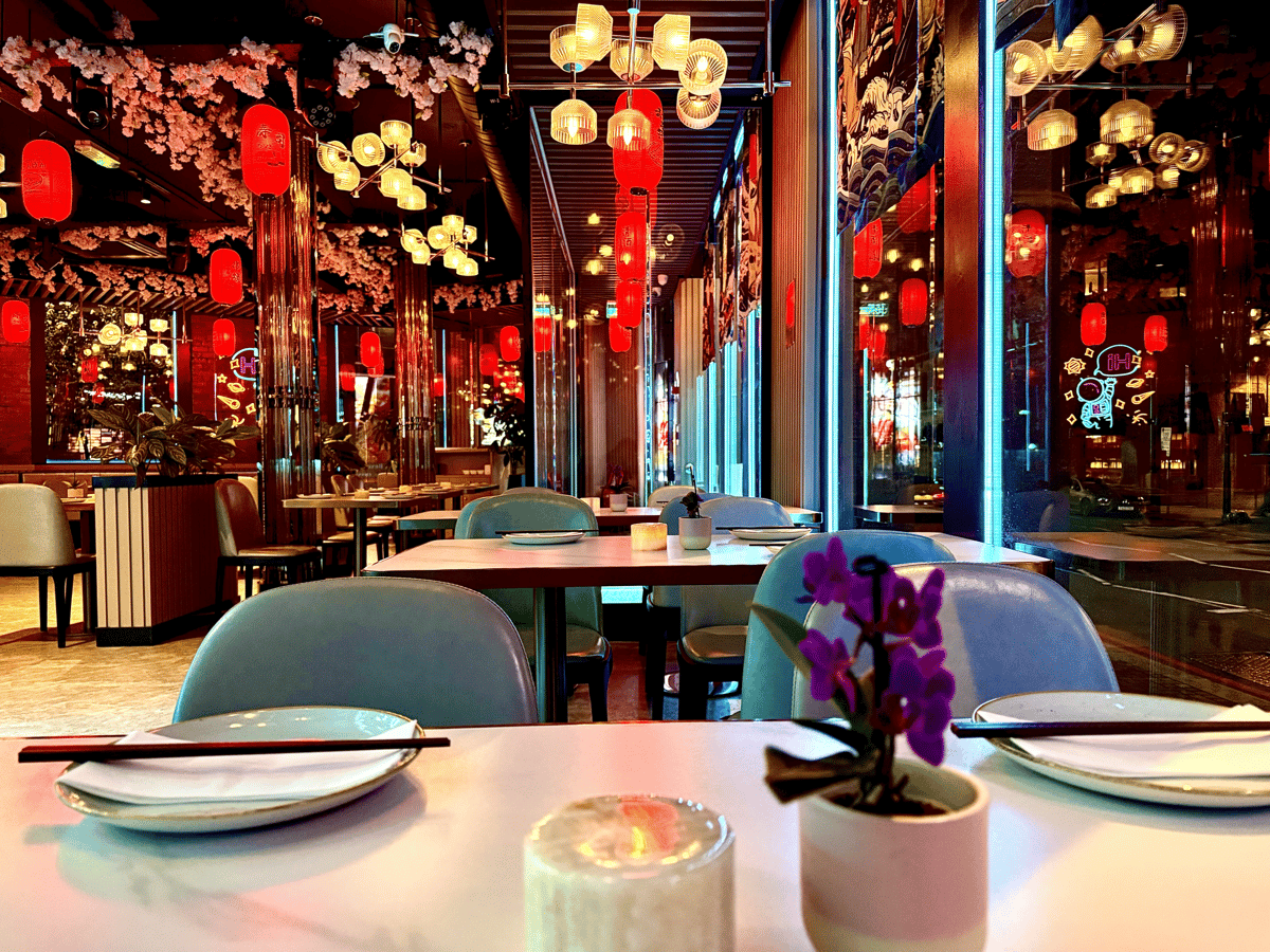 Elegant restaurant dining area with colorful floral decorations and table settings
