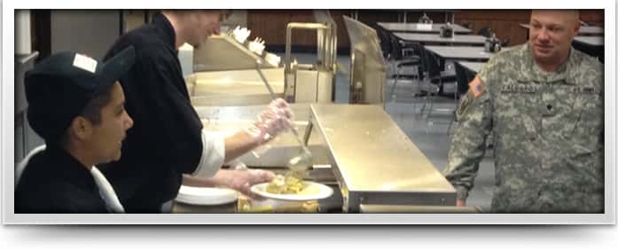 chefs in kitchen serving military 