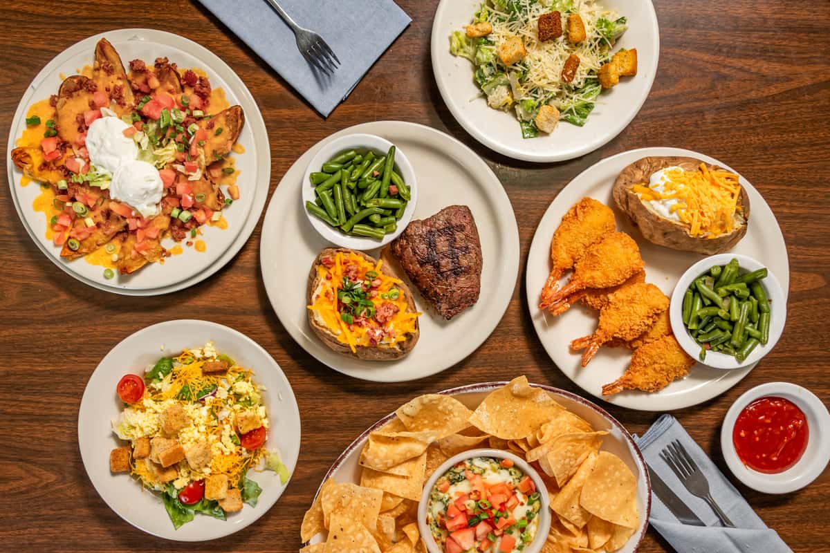 spread of food including steak, veggies and more