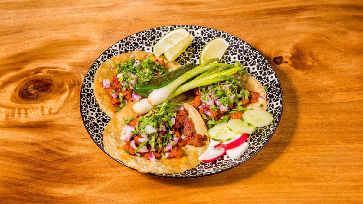 Crispy fish tacos topped with pico de gallo, avocado, and fresh cilantro.