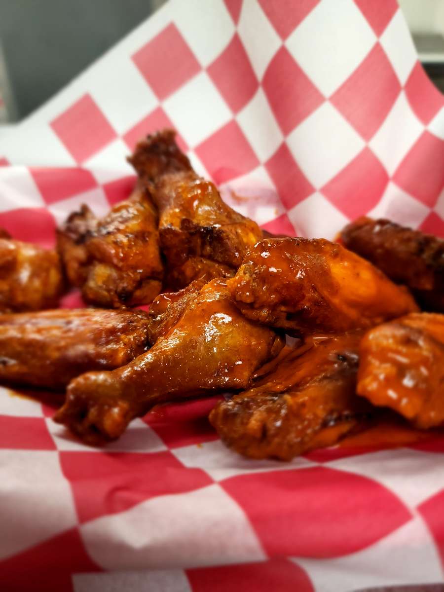 Smoked then Fried Bone-In or House Breaded Boneless 
Sauce: Buffalo | BBQ | Asian | Sweet Chili | Jerk Dry Rub | Sriracha | Sassy BBQ | Garlic Parmesan |Bourbon
We cannot do all Drummies or Flats