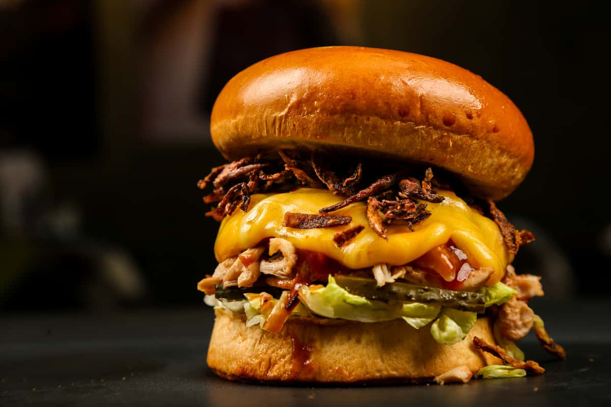 Burger with cheese salad and bacon