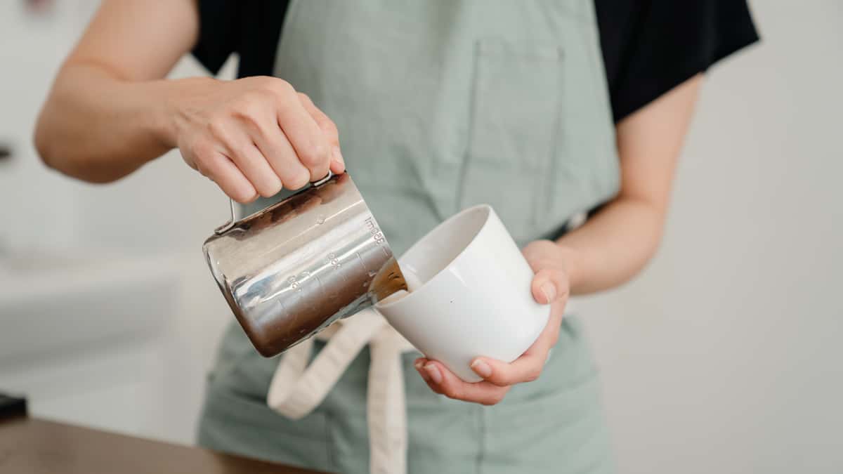 Coffee being poured into a cup