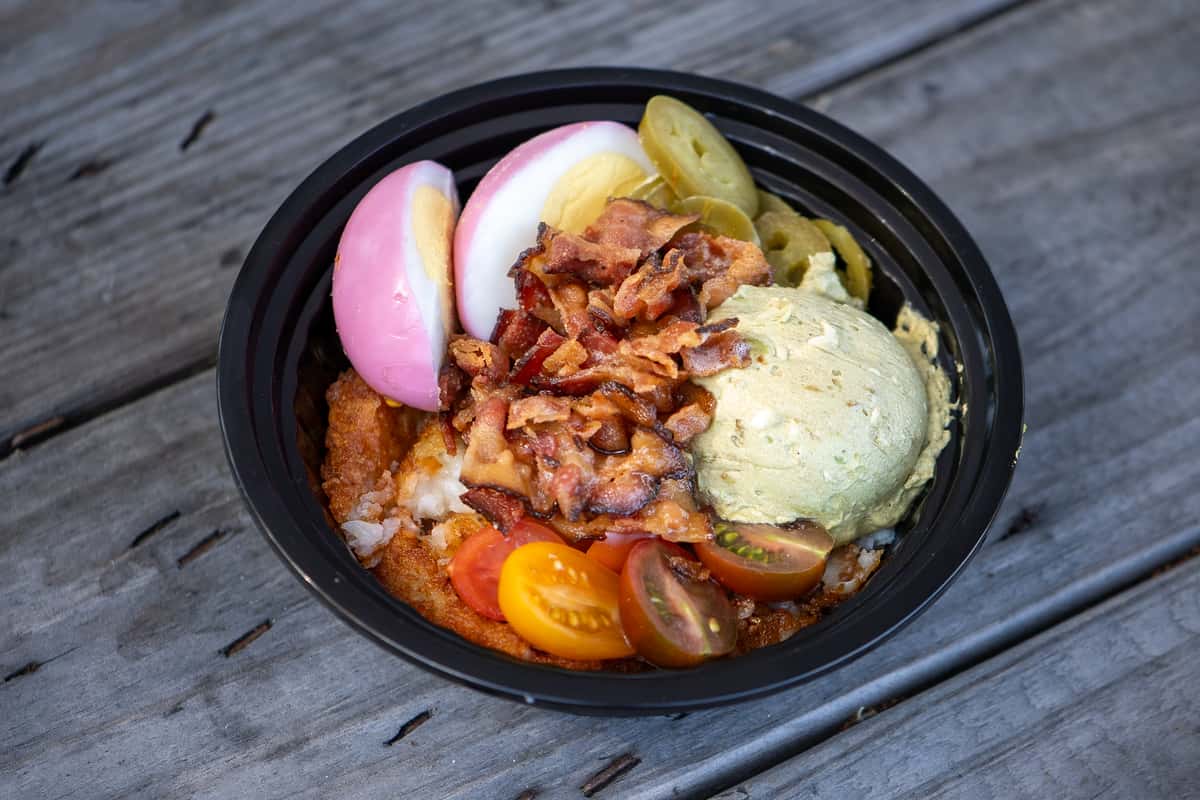 bowl of veggies, meat and sauce