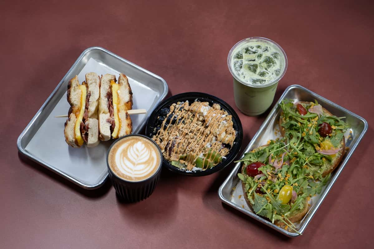 bagel on a sticl with poke bowl, salad and coffee