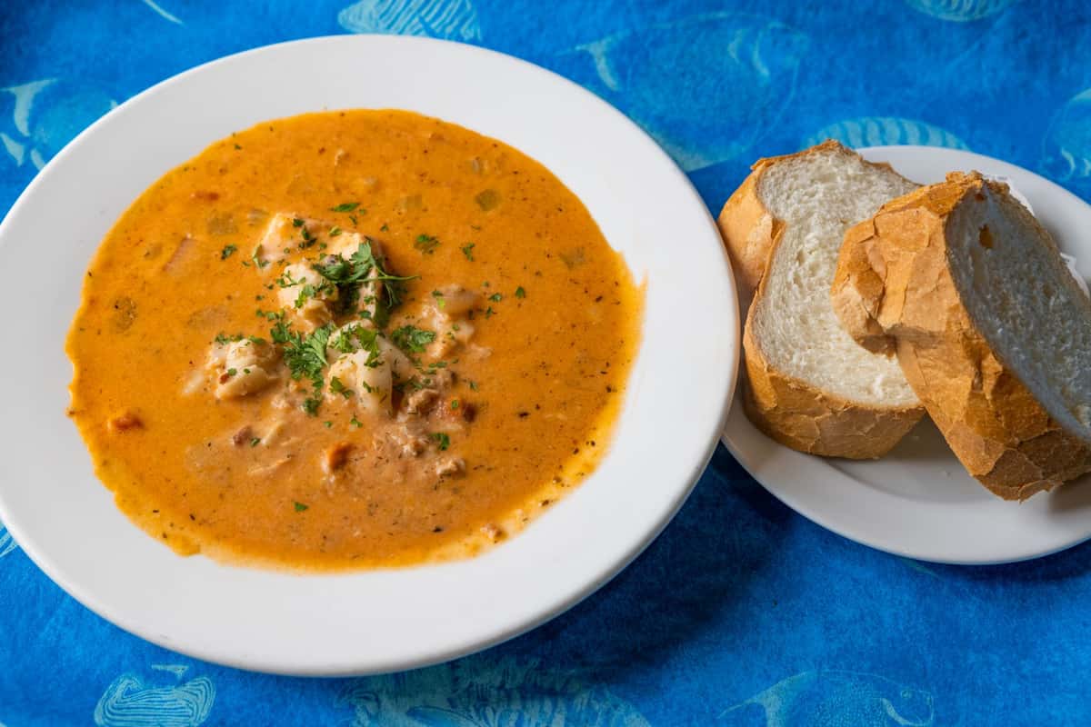 Both chowders mixed and heaped with loads of seafood