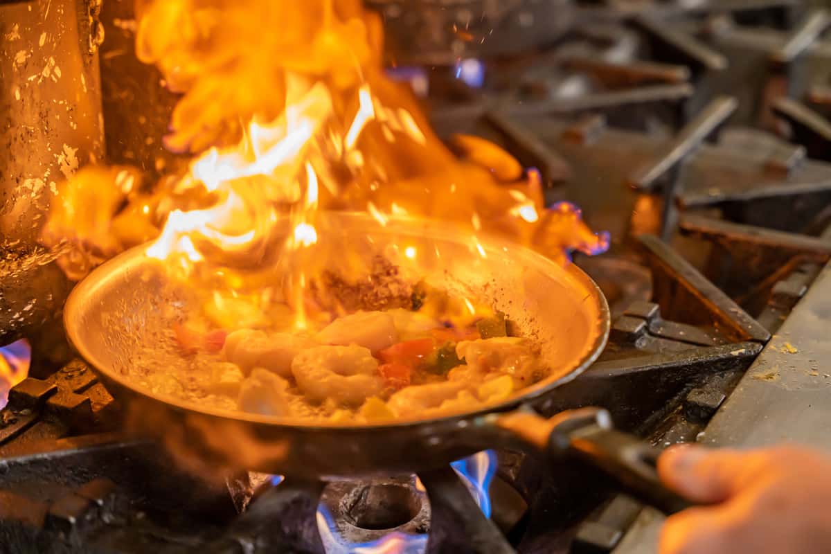 Chef flambéing shrimp