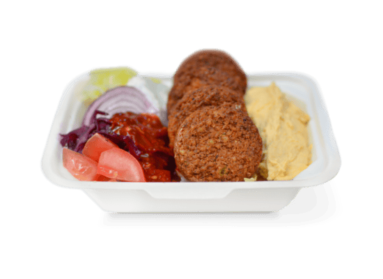 Crispy Turkish falafel served with hummus, fresh vegetables, and pickled peppers in a traditional entrée platter from Ebby's Turkish Kitchen.