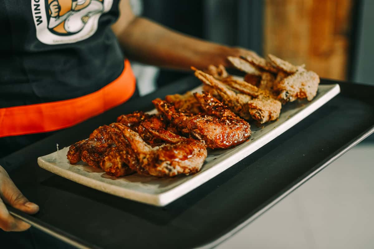 Wings being served by staff