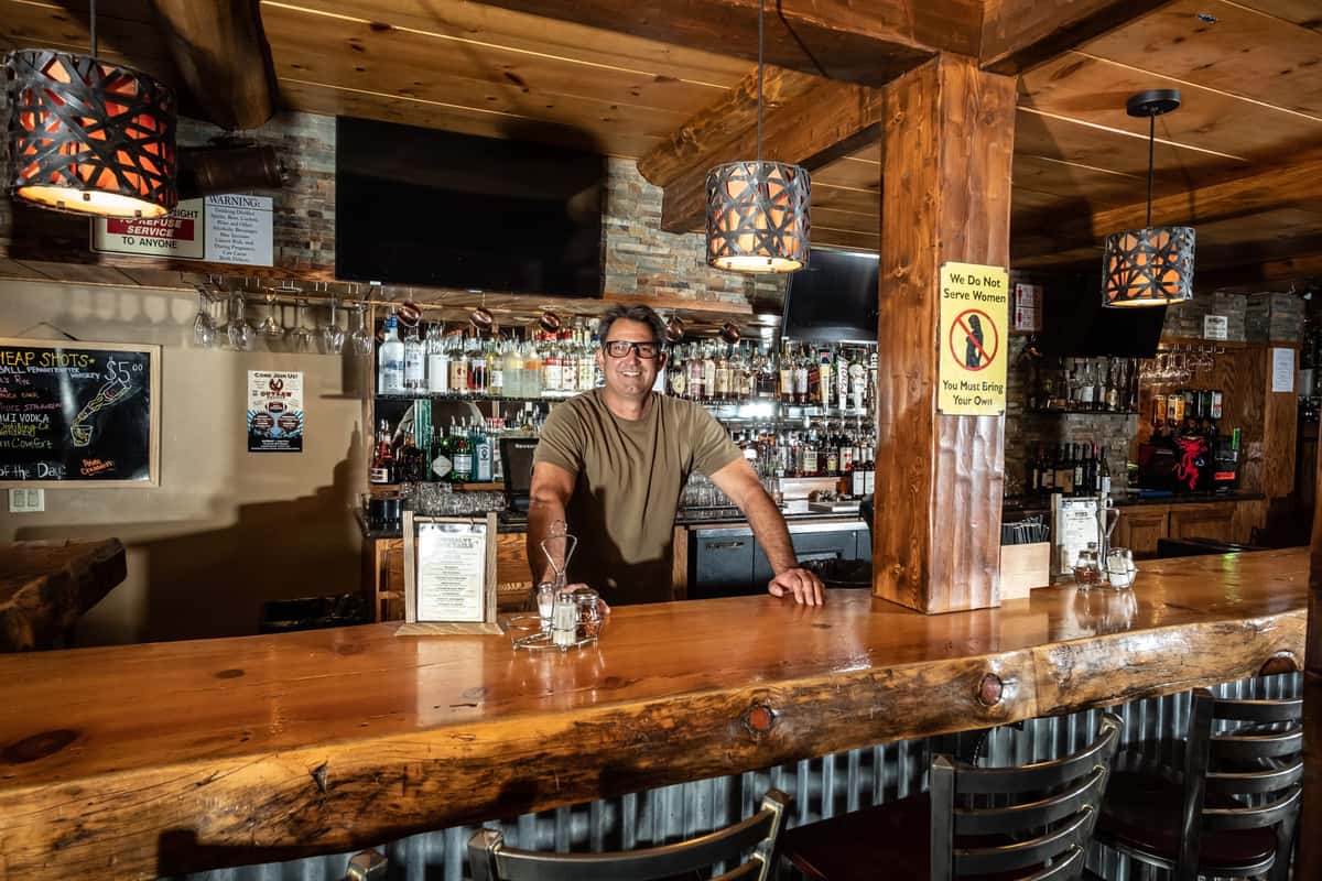Man behind bar counter