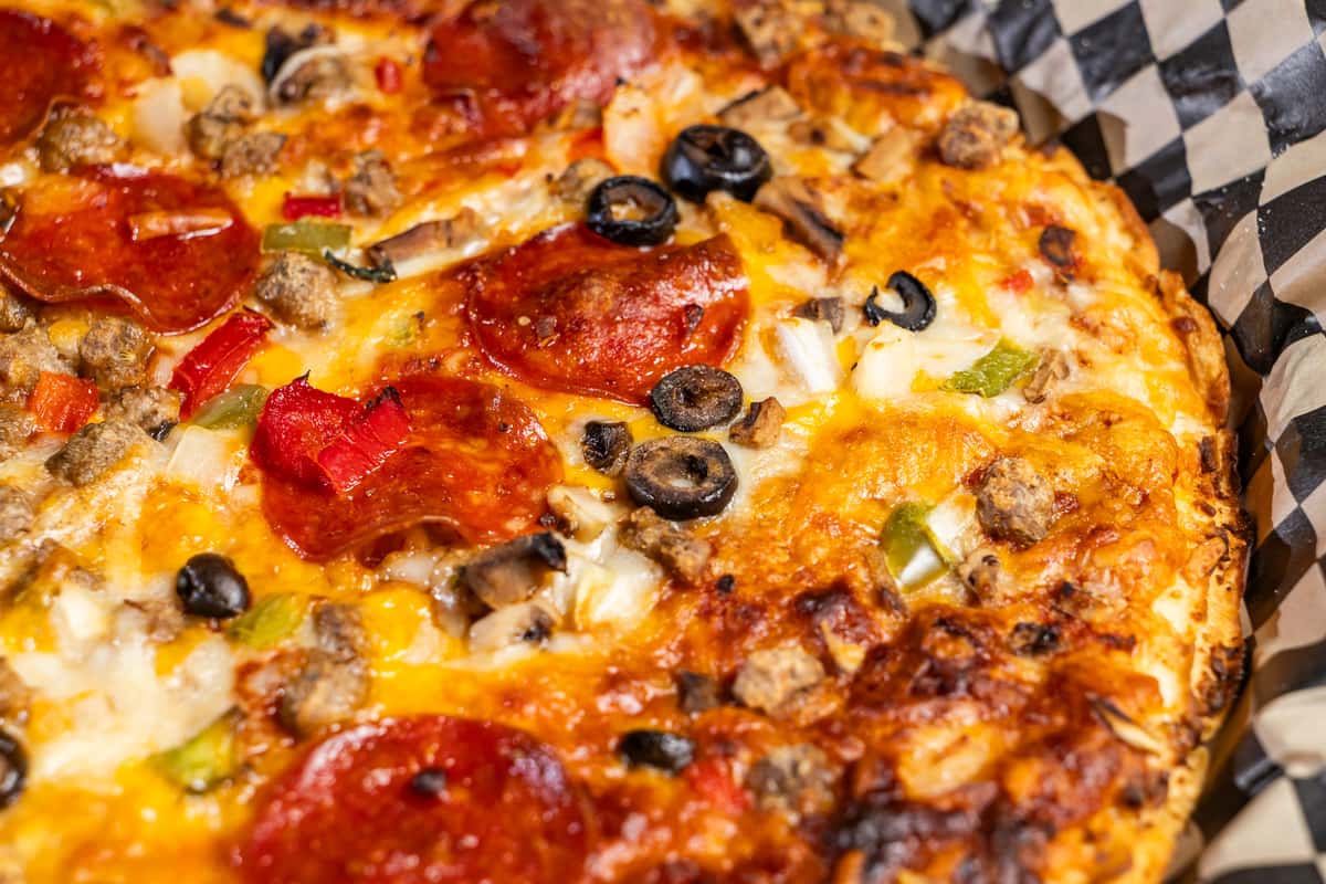 Close up of Supreme Pizza from The Riot