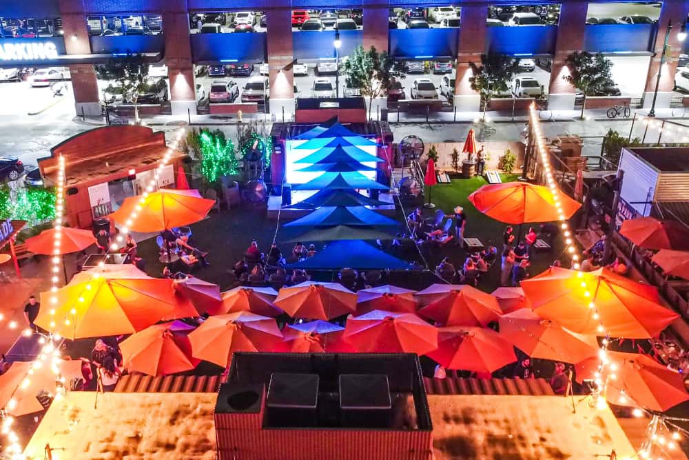 The Park at O.H.S.O. Gilbert in Downtown Gilbert, featuring a large Jumbotron, outdoor seating, games, string lights, and space for large group events.
