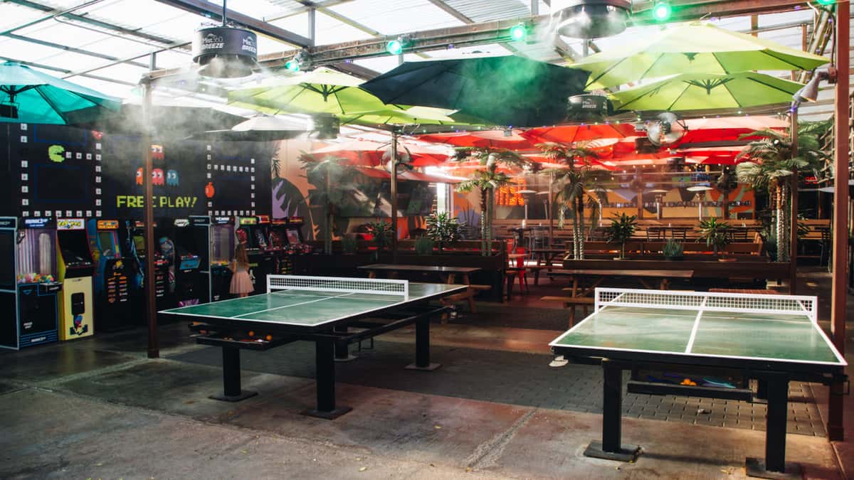 Free game zone at O.H.S.O. Paradise Valley in Phoenix with basketball games, ping pong tables, and covered outdoor space.