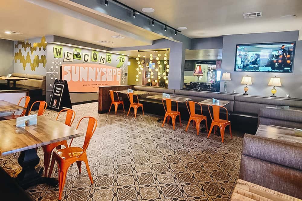 Indoor semi-private dining space at O.H.S.O. Sunnyslope in Phoenix with booth and table seating for group gatherings.