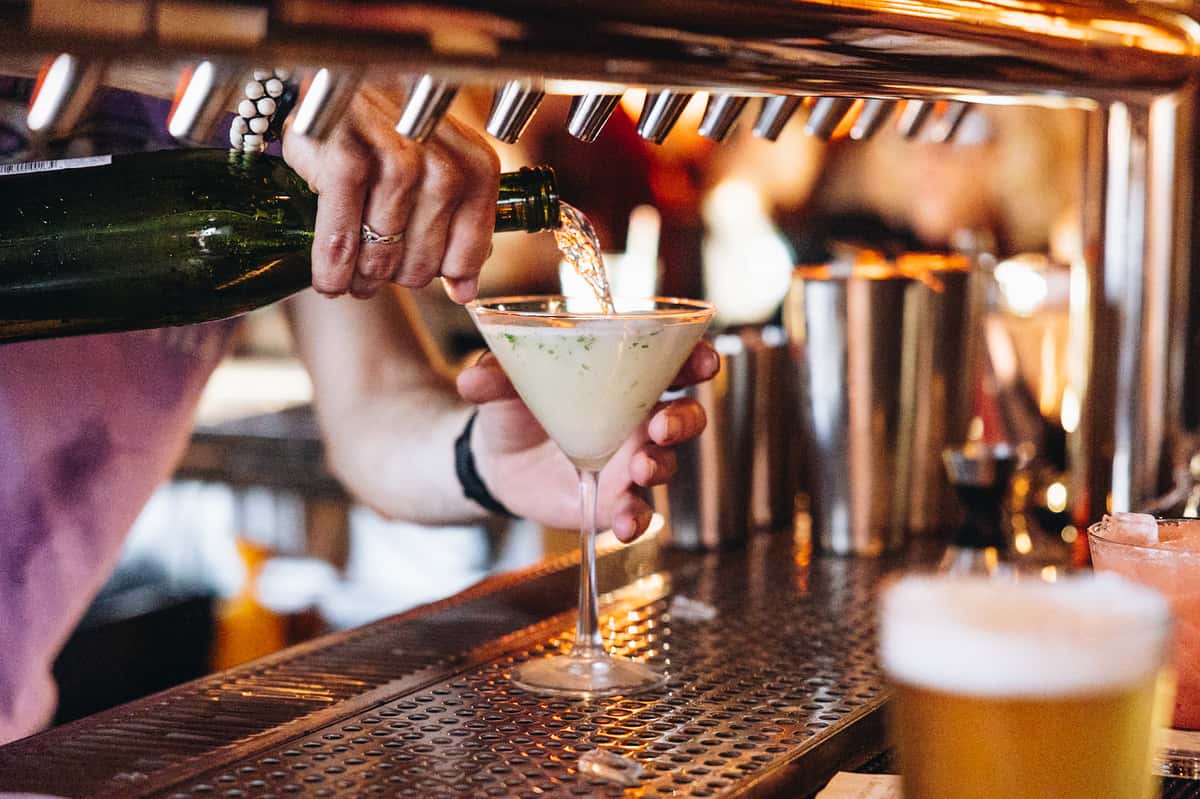 Bartender pouring espresso martini at a private event
