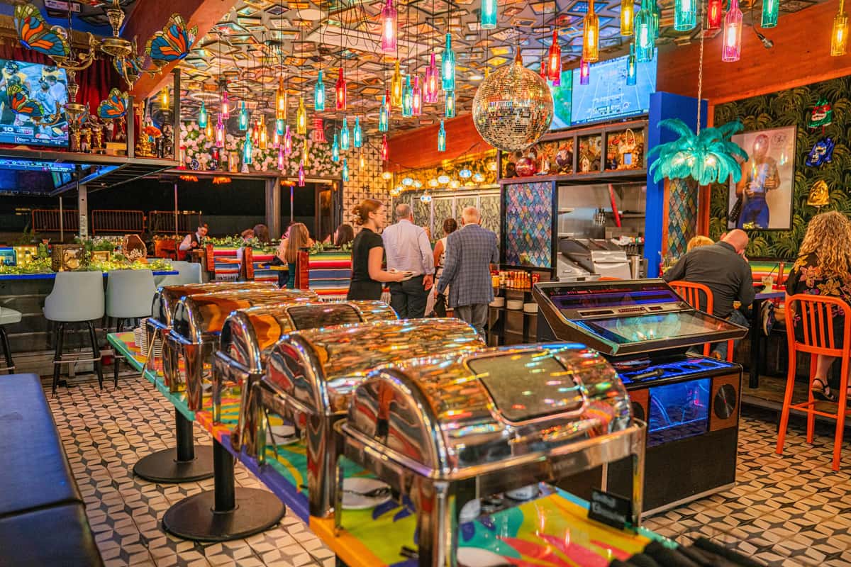 A catered event in an indoor colorful space at OHSO Arcaida Party House.