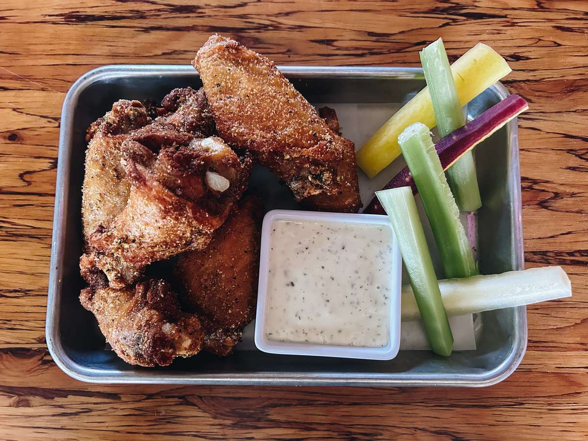 Lemon pepper dry rub wings served with carrots, celery and dill ranch