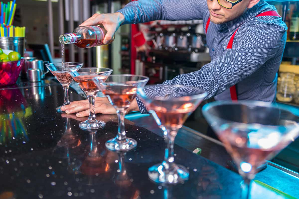 Bartender pouring drinks