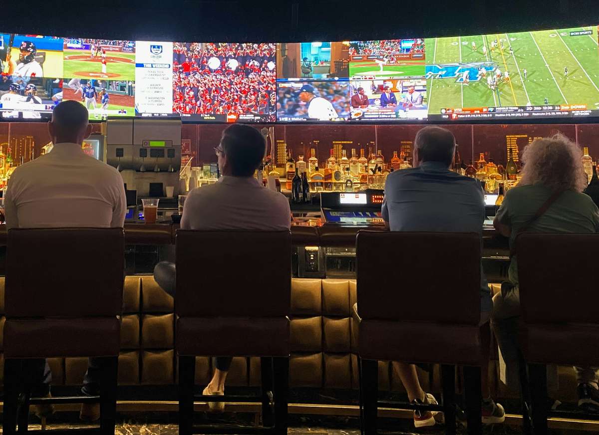 people watching TV at the bar