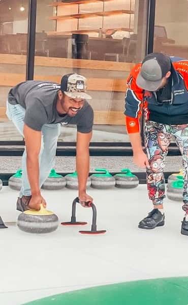 Men learning to curl