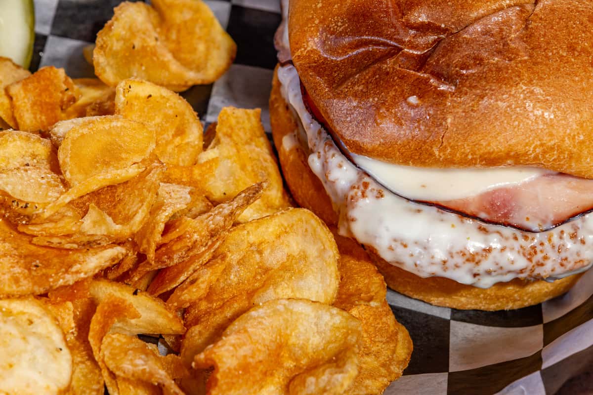 Cordon bleu sandwich with ham, melted cheese, and crispy chips at The Gaslight Pizza & Grill in Huntingburg, Indiana
