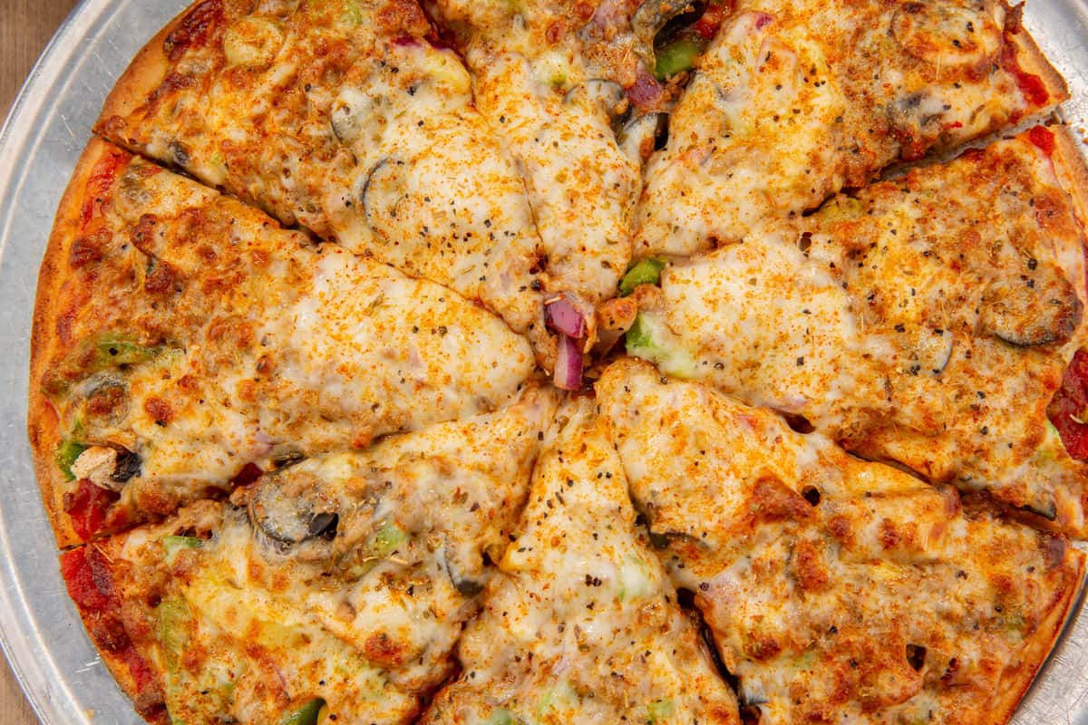 Close-up of a cheese pizza with sliced toppings at The Gaslight Pizza & Grill in Huntingburg, Indiana