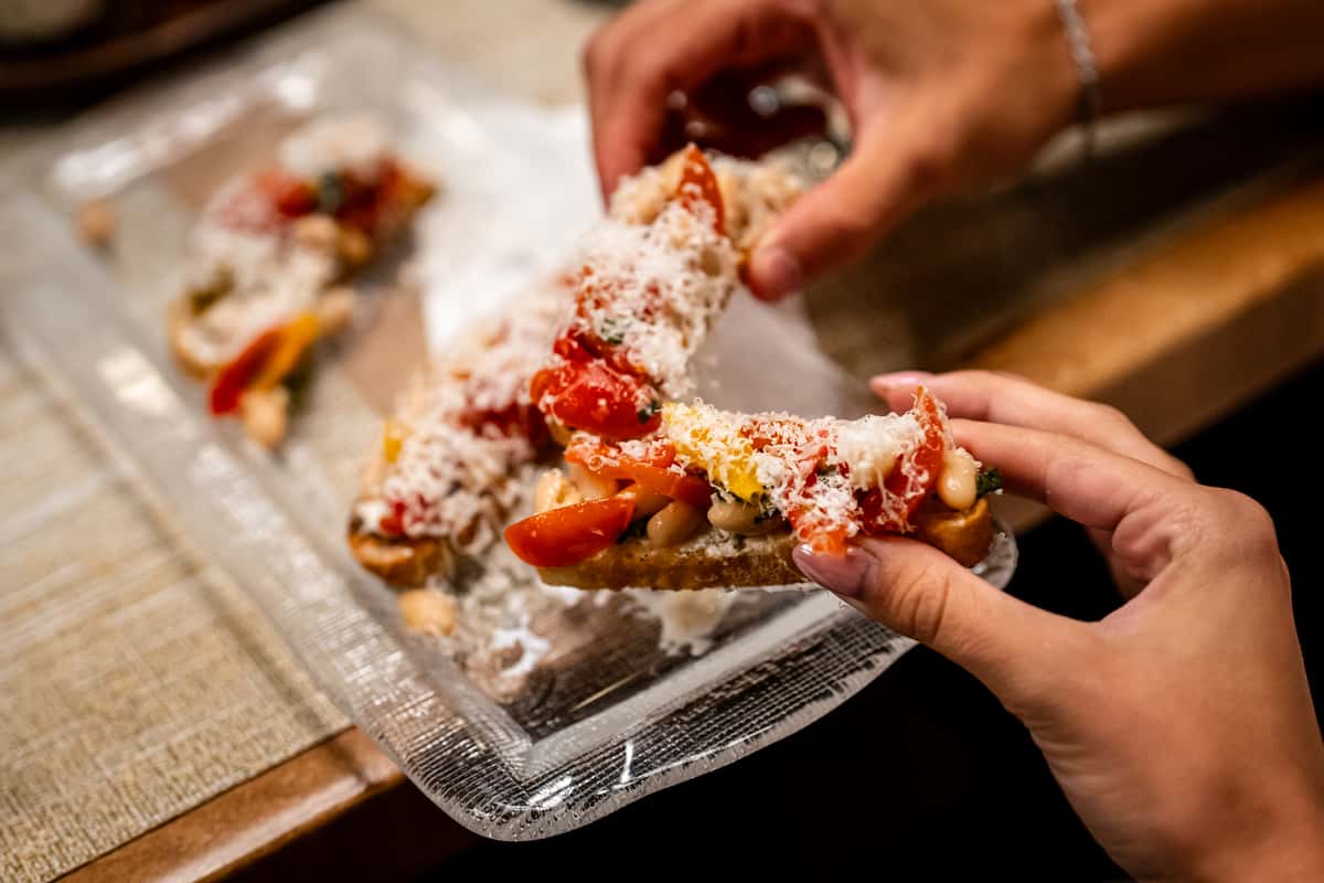 Hand holding Bruschetta