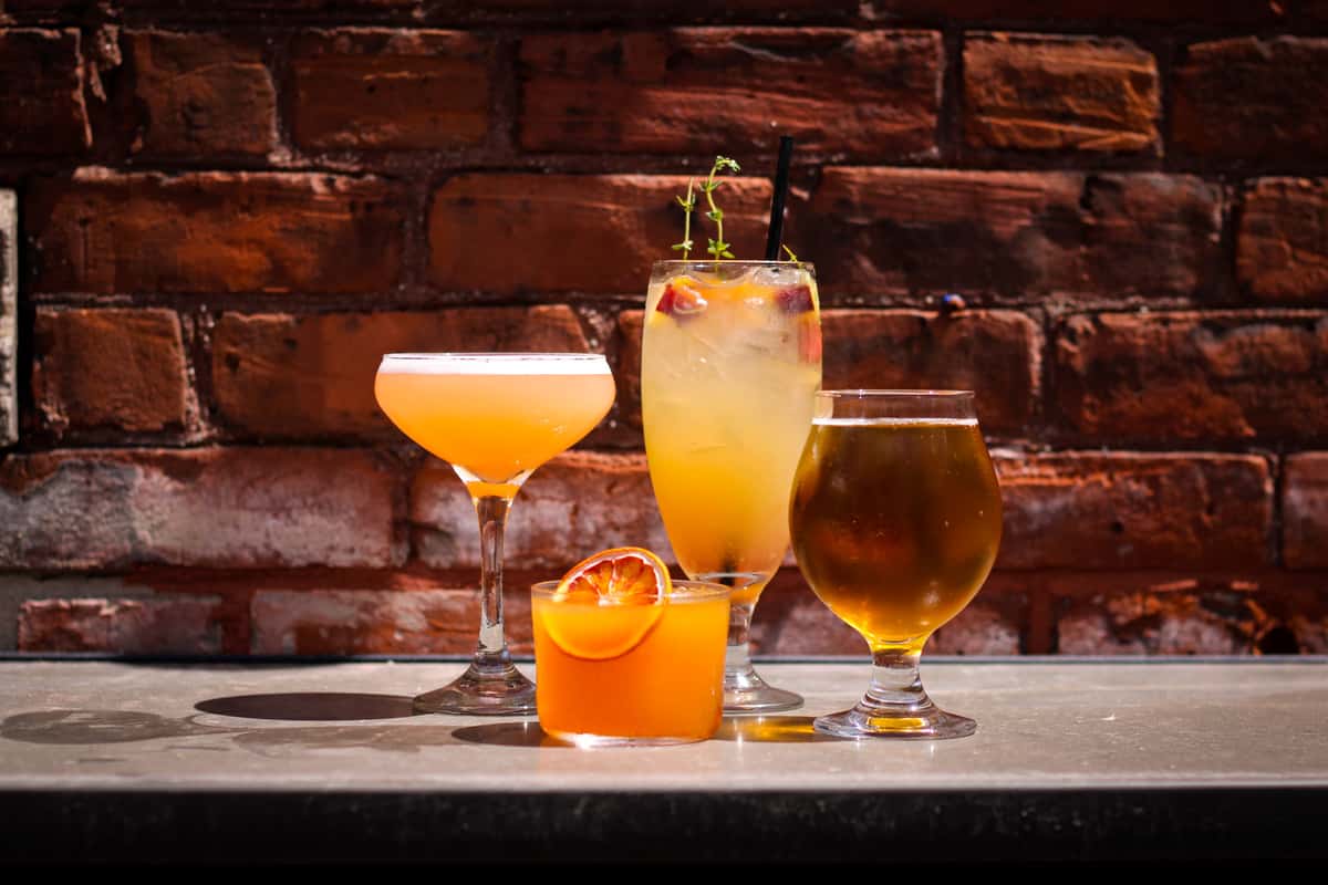 cocktails and beer with brick background